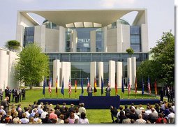 President George W. Bush answers questions during a press conference with German Chancellor Gerhard Schroeder in the courtyard of the Kanzleramt-Chancellery Building in Berlin, Germany, Thursday, May 23. White House photo by Paul Morse.