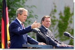 President George W. Bush and German Chancellor Gerhard Schroeder participate in a press conference in the courtyard of Kanzleramt-Chancellery Building in Berlin, Germany, Thursday, May 23. White House photo by Paul Morse.