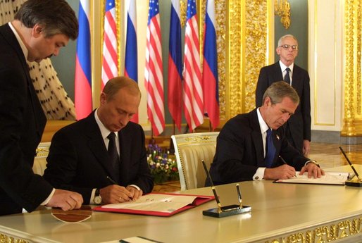 President George W. Bush and Russian President Vladimir Putin sign an arms reduction treaty at the Kremlin in Moscow, Russia on May 24, 2002. 