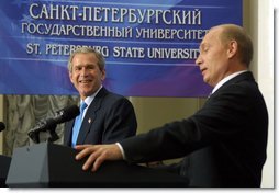 President George W. Bush laughs at a comment by Russian President Vladimir Putin during a question and answer session with students at St. Petersburg State University in St Petersburg, Russia on May 25, 2002. White House photo by Paul Morse.