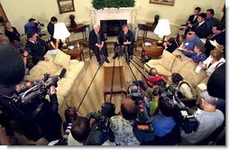 President George W. Bush talks to the White House Press pool after his meeting with Israeli Prime Minister Ariel Sharon inside the Oval Office, Monday, June 10. White House photo by Eric Draper.