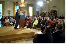 President George W. Bush discusses public education at the White House Conference on Character and Community in the East Room June 19. "I believe that public schools are the most important institutions in democracy," said the President. "And a good education is the birthright of every American child. Every public school must be the pathway to a better life." White House photo by Paul Morse.