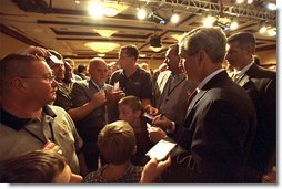 President George W. Bush meets with the delegates and their families during his visit to the United Brotherhood of Carpenters and Joiners of America 2002 Legislative Conference in Washington, D.C., Wednesday, June 19. White House photo by Tina Hager.