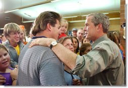 President George W. Bush greets familes displaced by the Arizona forest fires at Round Valley High School in Eagar, Ariz., Tuesday, June 25. White House photo by Eric Draper.