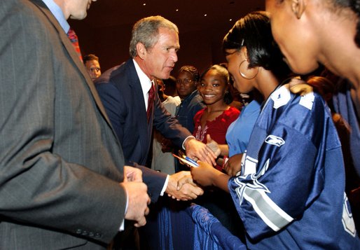 President George W. Bush greets students after remarks at Parkview Arts and Science Magnet High School in Little Rock, Arkansas, Thursday, Aug. 29. 