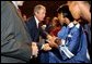 President George W. Bush greets students after remarks at Parkview Arts and Science Magnet High School in Little Rock, Arkansas, Thursday, Aug. 29. White House photo by Eric Draper.