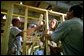 President Bush pitches in on a construction project during a tour of the Carpenters Joint Apprenticeship Center in Pittsburgh, Pa. The President’s Council of Economic Advisers, CEA, estimates the Jobs and Growth plan will create 1.4 million new jobs by the end of 2004, with 510,000 jobs created in 2003 and another 891,000 jobs created in 2004. White House photo by Paul Morse.