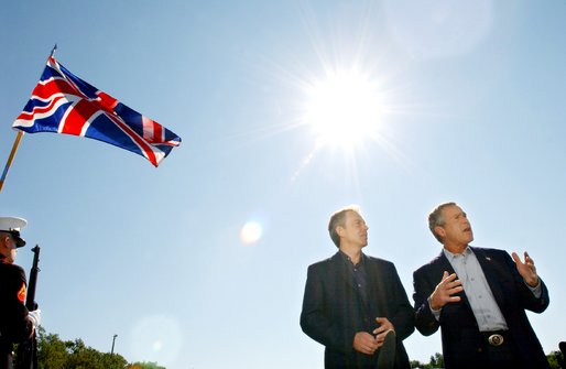 President George W. Bush answers questions from reporters following the arrival of British Prime Minister Tony Blair at Camp David, Saturday, Sept. 7, 2002. White House photo by Eric Draper.