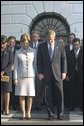 President George W. Bush and Laura Bush join the White House staff in bowing their heads in a moment of silence on the South Lawn of the White House 8:46 a.m. Wednesday, Sept 11. The President observed this moment to mark the one-year anniversary of when United Airlines Flight 175 crashed into the South Tower of the World Trade Center. White House photo by Eric Draper.