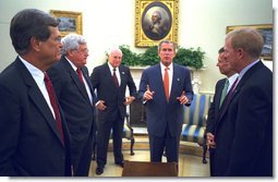 President George W. Bush along with Vice President Dick Cheney talk with Congressional Leaders Wednesday, Sept. 18, 2002, in the Oval Office. White House photo by Eric Draper.