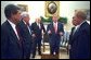 President George W. Bush along with Vice President Dick Cheney talk with Congressional Leaders Wednesday, Sept. 18, 2002, in the Oval Office. White House photo by Eric Draper.