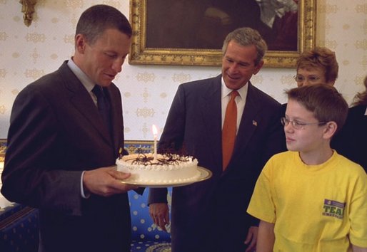 President George W. Bush and Matthew Skowronski, 13, a leukemia survivor, (right), admire the cake Lance Armstrong was given by the White House in honor of his 31st birthday. Armstrong, a cancer survivor and 4-time winner of the Tour De France, spoke Wednesday, Sept. 18, to encourage and support new cancer survivorship initiatives and legislation. White House photo by Paul Morse.