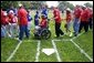 T-Ball teams from East Brunswick New Jersey Babe Ruth Buddy Ball League Sluggers in red and the Waynesboro Little League Challenger Division Sand Gnats in blue from Waynesboro, Virginia congratulate each other after playing Sunday September 22, 2002 on the South Lawn of the White House. White House photo by Paul Morse