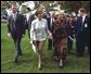 Laura Bush and Ludmila Putina, wife of Russian Federation President Vladimir Putin, stroll across the lawn of the Capitol visiting the tents of authors and story tellers at the Second Annual National Book Festival Saturday, October 12, 2002. White House photo by Susan Sterner.