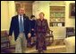 President George W. Bush laughs with Ludmila Putina, wife of Russian Federation President Vladimir Putin, during an impromptu tour of the Oval Office Saturday, October 12, 2002. Mrs. Putina then joined Laura Bush on a visit to the Second Annual National Book Festival on the west side of the Capitol. More than 70 authors, story tellers and athletes read from their works, signed books and encouraged reading for all ages. White House photo by Susan Sterner