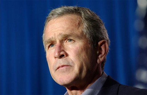 As the flag at the White House is flown at half-staff, President George W. Bush expresses condolences in his opening remarks during his and President Jiang Zemin's joint press conference in Crawford, Texas, Oct. 25. "Our prayers and heart-felt sympathy goes to their sons, their loved ones, their friends, and the people of Minnesota," said the President. White House photo by Tina Hager.