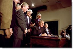 President George W. Bush signs H.R. 3295, Help America Vote Act of 2002, into law in the Dwight D. Eisenhower Executive Office Building Tuesday, Oct. 29. The legislation authorizes 3.9 billion dollars for improvements in state and local election systems. "Each state will be required to maintain a clean and current and accurate state -- statewide list of registered voters, making it easier to register and easier to detect fraud," explained the President. White House photo by Paul Morse.