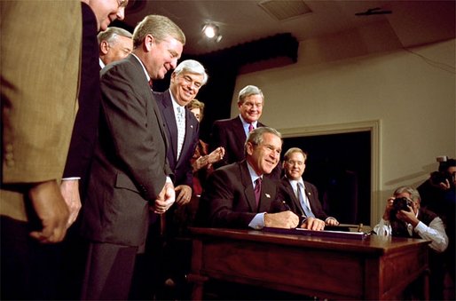 President George W. Bush signs H.R. 3295, Help America Vote Act of 2002, into law in the Dwight D. Eisenhower Executive Office Building Tuesday, Oct. 29. The legislation authorizes 3.9 billion dollars for improvements in state and local election systems. "Each state will be required to maintain a clean and current and accurate state -- statewide list of registered voters, making it easier to register and easier to detect fraud," explained the President. White House photo by Paul Morse.