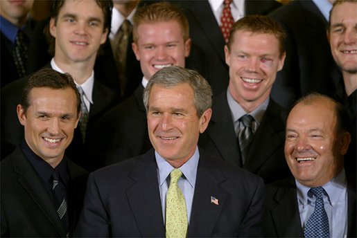 President George W. Bush stands with the Detroit Red Wings, who brought the NHL 2002 Stanley Cup to the White House Friday, Nov. 8. "But let me tell you what I'm most impressed with, about how the players and the owners have used this championship victory," said the President. "One afternoon, Steve Yzerman brought the cup to children in three different hospitals across the state of Michigan. The Ilitch family used the cup to raise a lot of money for a local emergency room. The coach made a dream come true for a child with leukemia, who just simply wanted to touch the Stanley Cup." White House photo by Paul Morse.