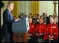 President George W. Bush makes remarks to American and British veterans ( seated in background) in the East Room of the White House on Veteran's Day, November 11, 2002 White House photo by Paul Morse