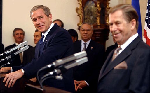 President George W. Bush listens to an interpreter during a joint press conference with Czech Republic President Vaclav Havel at Prague Castle in Prague, Czech Republic, Wednesday Nov. 20. White House photo by Paul Morse