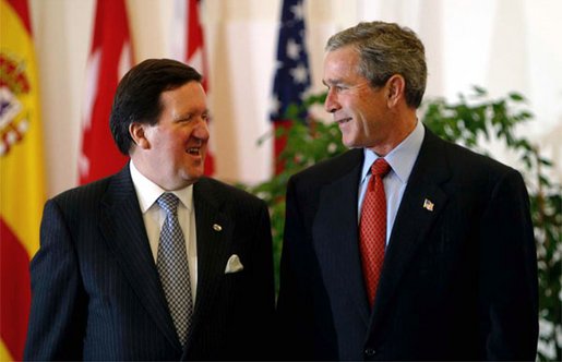 President George W. Bush talks with NATO Secretary General Lord George Robertson at the beginning of the North Atlantic Council Summit in Prague, Czech Republic, Thursday, Nov. 21. White House photo by Paul Morse.