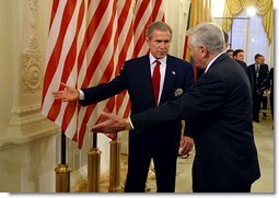 President George W. Bush and Lithuanian President Valdas Adamkus enter a bilateral meeting after President Bush received the Order of Vytautas the Great at the Prezidentura in Vilnius, Lithuania, Nov. 23. The medal is given to individuals whose contributions have benefited the Lithuanian nation or the welfare of mankind. White House Photo by Paul Morse. 