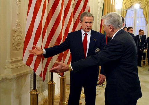 President George W. Bush and Lithuanian President Valdas Adamkus enter a bilateral meeting after President Bush received the Order of Vytautas the Great at the Prezidentura in Vilnius, Lithuania, Nov. 23. The medal is given to individuals whose contributions have benefited the Lithuanian nation or the welfare of mankind. White House Photo by Paul Morse.