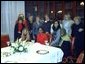 National Security Advisor Condoleeza Rice takes a group photo at the Karamah Iftaar Dinner.