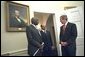 President George W. Bush welcomes President Daniel arap Moi of Kenya, left, and Prime Minister Meles Zenawi of Ethiopia to the Oval Office Dec. 5. "We welcome two strong friends of America here; two leaders of countries which have joined us in the -- to fight the global war on terror; two steadfast allies, two people that the American people can count on when it comes to winning the first war of the 21st century," said President Bush during their meeting in the Cabinet Room. White House photo by Eric Draper