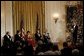 President George W. Bush welcomes the recipients of the Kennedy Center Honors of 2002 to the White House Sunday, Dec. 8. Each year The John F. Kennedy Center for the Performing Arts honors a select number of artists for lifetime achievements and their influence upon American culture. From left to right, the recipients are actor James Earl Jones; conductor James Levine; dancer and actress Chita Rivera; singer Paul Simon and actress Elizabeth Taylor. White House photo by Susan Sterner