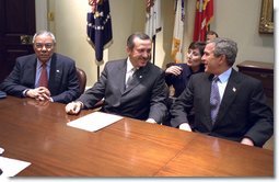 President George W. Bush meets with Recep Tayyip Erdogan, Chairman of Turkey's AK Party during National Security Advisor Dr. Condoleezza Rice's meeting in the Roosevelt Room, Tuesday, Dec. 10, 2002. Also pictured is Secretary of State Colin Powell. "We join you, side by side, in your desire to become a member of the European Union. We appreciate your friendship in NATO. You're a strategic ally and friend of the United States, and we look forward to working with you to keep the peace, " said President Bush during the brief meeting.   White House photo by Paul Morse