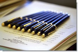 Awaiting the President's hand, pens are lined up for several bill signings in the Oval Office Tuesday, Dec. 17.  White House photo by Paul Morse