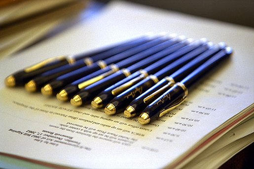 Awaiting the President's hand, pens are lined up for several bill signings in the Oval Office Tuesday, Dec. 17. White House photo by Paul Morse.