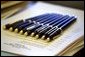 Awaiting the President's hand, pens are lined up for several bill signings in the Oval Office Tuesday, Dec. 17. White House photo by Paul Morse