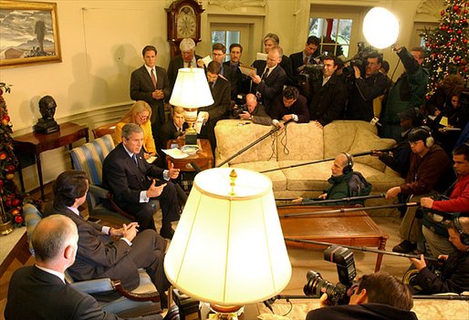 President George W. Bush and President Jose Aznar of Spain make a joint statement to the media in the Oval Office Wednesday, Dec. 18. White House photo by Tina Hager