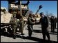 President George W. Bush greets army soldiers in front of tank equipment during a visit to Fort Hood in Killeen, Texas, Friday, Jan. 3, 2003. White House photo by Eric Draper.