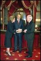 In his role as President of the Senate, Vice President Dick Cheney presides over the swearing in of 35 new senators as part of the opening of the 108th Congress Tuesday Jan. 7, 2003. Here, the Vice President congratulates newly-elected Senator Elizabeth Dole, R-N.C., in the Old Senate Chamber of the Capitol as her husband, former Senator Bob Dole, looks on. White House photo by David Bohrer