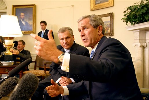 President George W. Bush and Polish President Aleksander Kwasniewski meet with the media in the Oval Office Jan. 14, 2003. White House photo by Paul Morse.