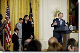 President George W. Bush addresses the audience during a program honoring graduates of welfare-to-work programs in the East Room Tuesday, Jan. 14, 2003. "In the seven years since welfare was reformed, millions of Americans have shared in this experience. Their lives and our country are better off. Today, more than 2 million fewer families are on welfare -- 2 million fewer than in 1996. It's a reduction of 54 percent," said the President.  White House photo by Paul Morse