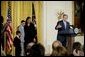 President George W. Bush addresses the audience during a program honoring graduates of welfare-to-work programs in the East Room Tuesday, Jan. 14, 2003. "In the seven years since welfare was reformed, millions of Americans have shared in this experience. Their lives and our country are better off. Today, more than 2 million fewer families are on welfare -- 2 million fewer than in 1996. It's a reduction of 54 percent," said the President. White House photo by Paul Morse.