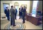 Shortly before delivering his remarks to the media, President George W. Bush discusses his decision regarding the University of Michigan Admission policies with, from left to right, Counsel Alberto Gonzales, Press Secretary Ari Fleischer, Assistant Jay Lefkowitz and Communications Director Dan Bartlett in the Oval Office Wednesday, Jan. 15, 2003. White House photo by Paul Morse