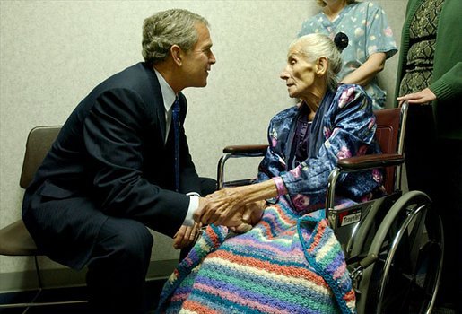  President George W. Bush visits with 94-year-old Anna Tovcimak, who is a hospice patient, after a roundtable discussion on Medical Liability Reform at Mercy Hospital in Scranton, Pa, Jan. 16, 2003. "I appreciate you all. giving me a chance to talk about a significant problem which faces America," said President Bush in his remarks. "And that problem is the fact that our medical liability system is broken, and therefore, a lot of Americans don't have access to affordable health care." White House photo by Tina Hager