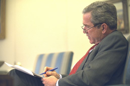 President George W. Bush prepares his State of the Union speech in the Oval Office Thursday, January 23, 2003. White House photo by Eric Draper