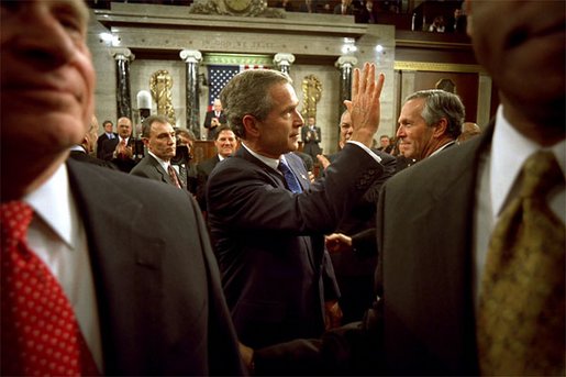 After delivering his State of the Union speech, President Bush waves to his wife, Laura Bush, as he leaves the House Chamber at the U.S. Capitol Tuesday, Jan. 28, 2003. White House photo by Eric Draper