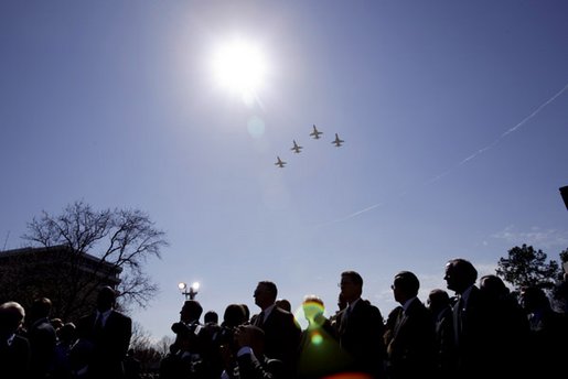 Honoring the seven astronauts who died in the Space Shuttle Columbia disaster, jets fly over the crowd in a missing man formation during a memorial service at the NASA Lyndon B. Johnson Space Center Tuesday, Feb. 4, 2003. White House photo by Paul Morse