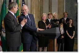 Standing with President George W. Bush, Secretary of Treasury John Snow addresses the media after his swearing-in ceremony at The Treasury Building Friday, Feb. 7, 2003.   White House photo by Paul Morse