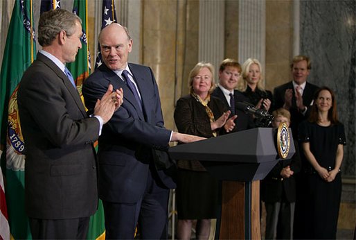 Standing with President George W. Bush, Secretary of Treasury John Snow addresses the media after his swearing-in ceremony at The Treasury Building Friday, Feb. 7, 2003. White House photo by Paul Morse