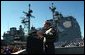 President George W. Bush speaks to sailors in front of the USS Philippine Sea at Naval Station Mayport in Mayport, Fla., Thursday, Feb. 13, 2003. White House photo by Eric Draper