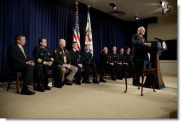 After an introduction by Attorney General John Ashcroft, far left, Vice President Dick Cheney speaks during the Medal of Valor Ceremony in the Dwight D. Eisenhower Executive Office Building Friday, Feb. 14, 2003. The Vice President and Attorney General presented 10 Medals of Valor to public safety officers who put their lives in danger helping people in danger.  White House photo by David Bohrer